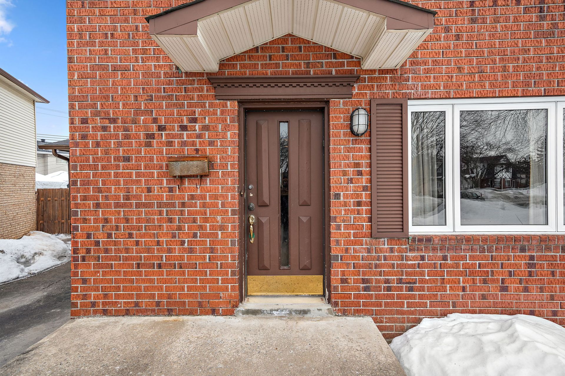 Front exterior of 242 Rue Autumn Montreal property listing